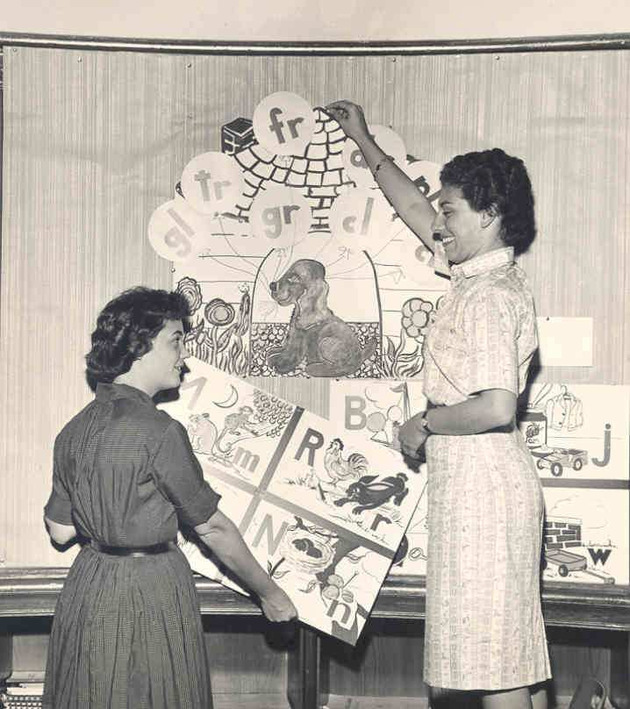 Students Barbara Kiep and Janet Burt preparing reading charts